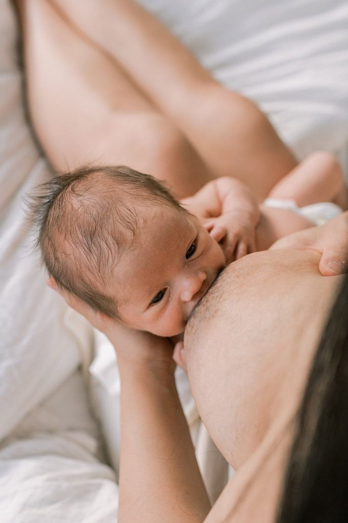 newborn baby breastfeeding photoshoot
